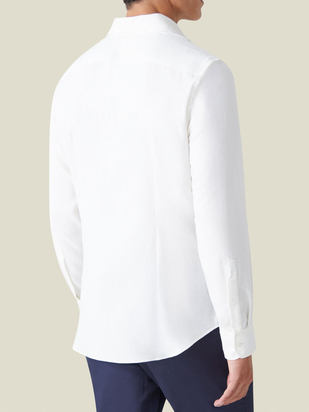 Back view of a model wearing the Luca Faloni White Cashmere-Cotton Shirt, showing its fit and rounded hem.