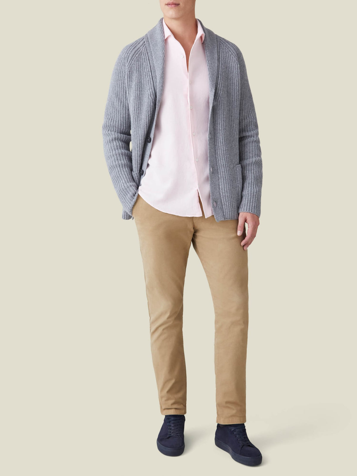 Model wearing the Light Pink Cashmere-Cotton Shirt, layered under a grey cardigan and paired with tan chinos.