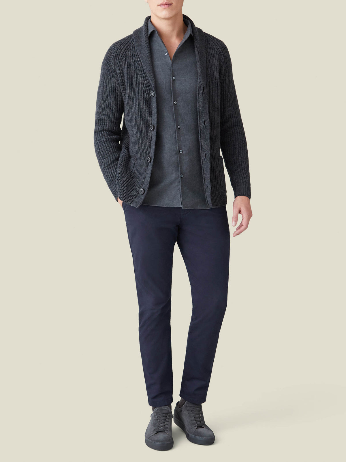 Model in a full outfit featuring the Charcoal Grey Cashmere-Cotton Shirt, knit cardigan, and navy trousers.
