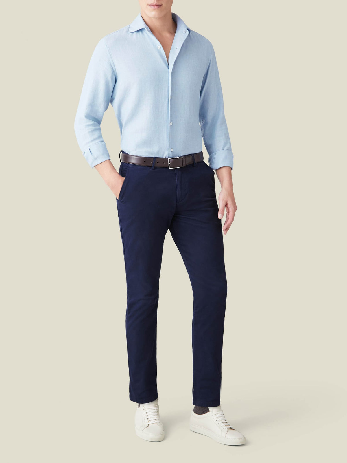 Front view of a model wearing the Luca Faloni Cashmere-Cotton Shirt in light blue with navy trousers.