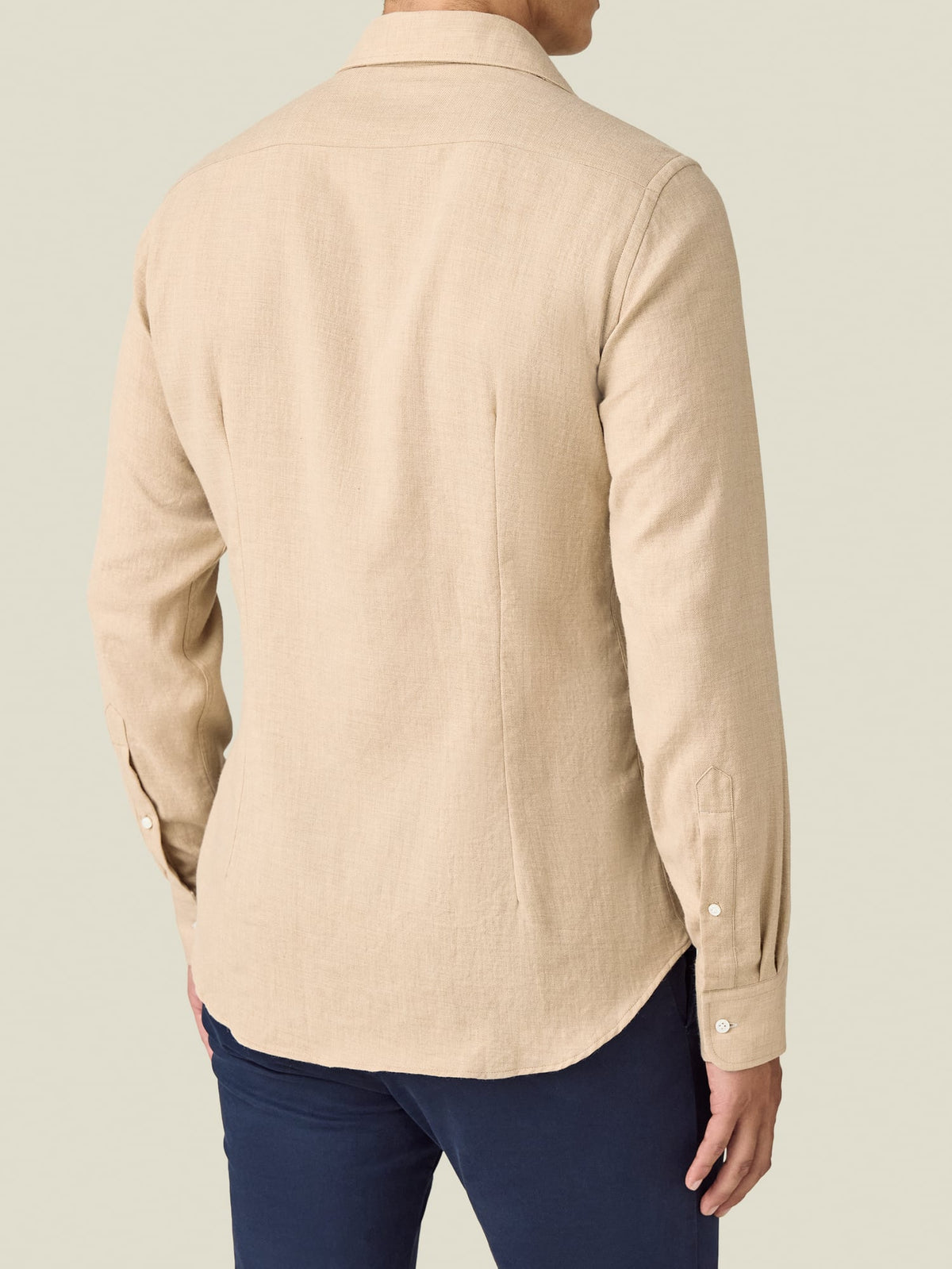 Back view of a model wearing the Luca Faloni Cashmere-Cotton Shirt in sand.