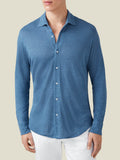 Front view of a model wearing the Steel Blue Linen Jersey Shirt paired with white trousers.