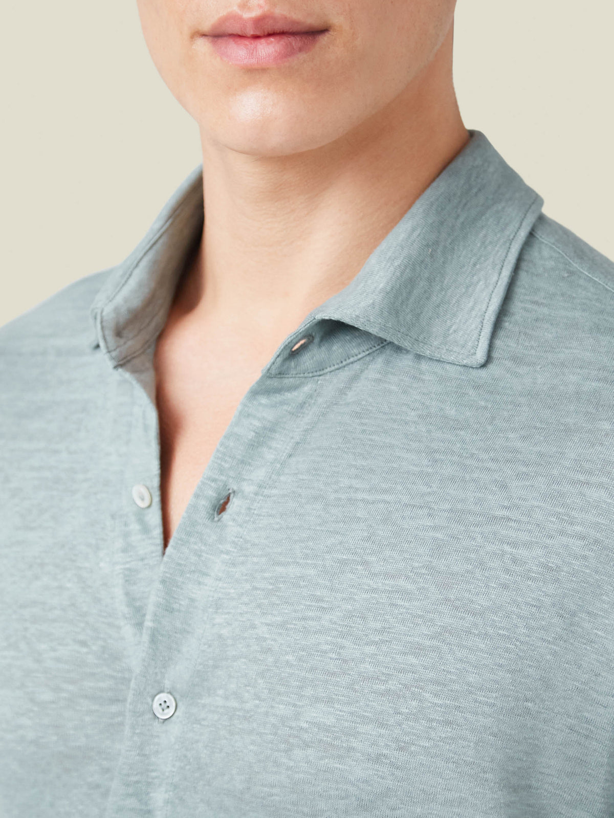 Close-up view of the cutaway collar and soft fabric on the Sea Grey Linen Jersey Shirt.