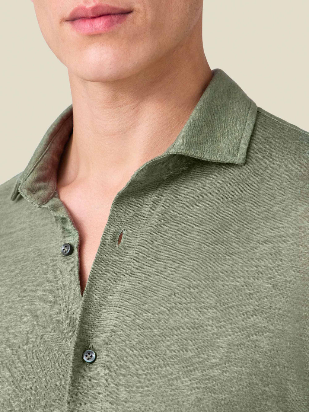 Detail shot of the cutaway collar and textured linen jersey fabric on the Olive Green Linen Jersey Shirt.