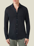 Front view of a model wearing the black long-sleeve Linen Jersey Shirt from Luca Faloni.