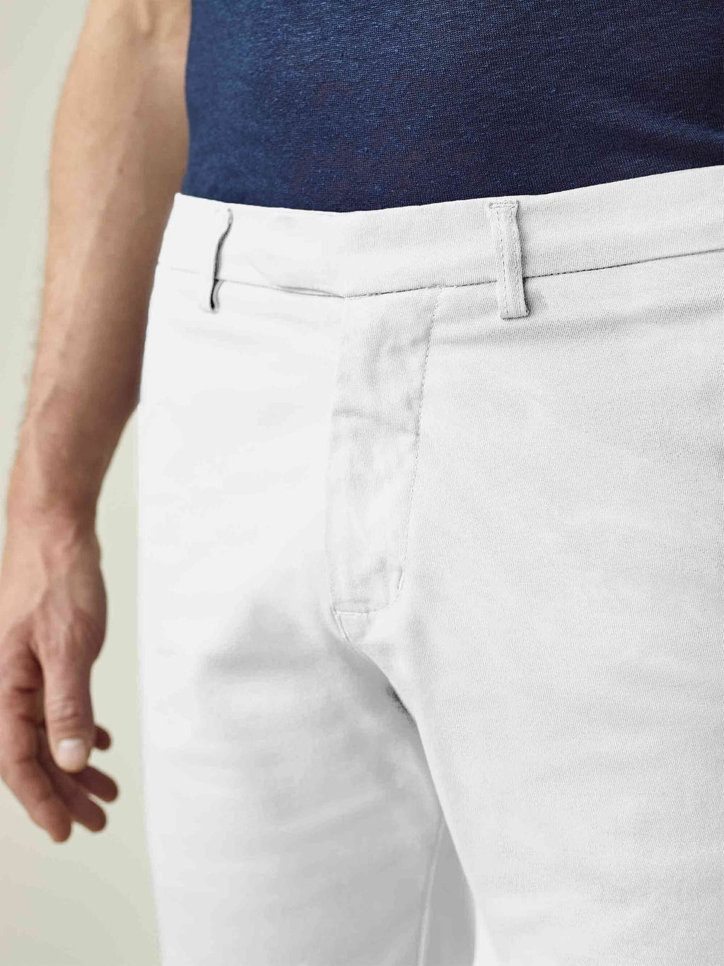 A close-up of the Luca Faloni White Cotton Shorts, showcasing the detailed waistband and textured whipcord cotton fabric.