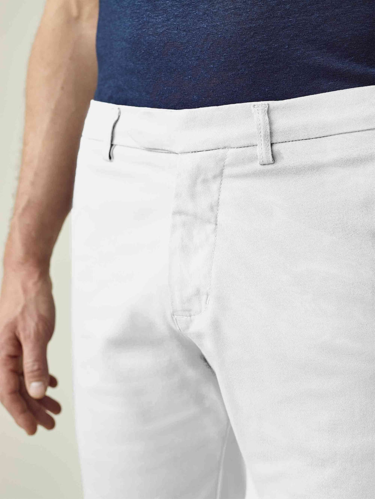 A close-up of the Luca Faloni White Cotton Shorts, showcasing the detailed waistband and textured whipcord cotton fabric.