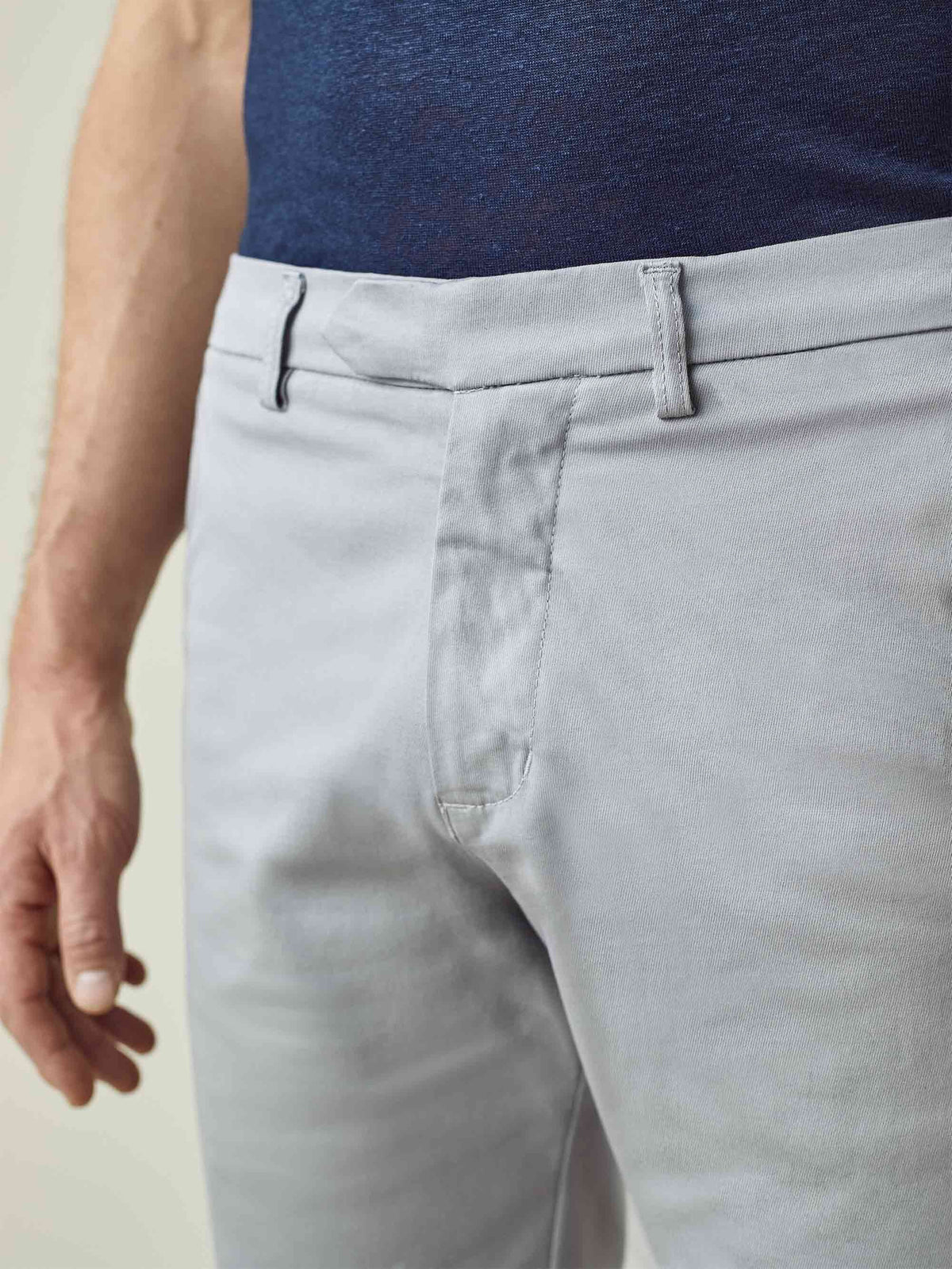 A close-up of the Luca Faloni Light Grey Cotton Shorts, showing the waistband, belt loops and concealed button fly.
