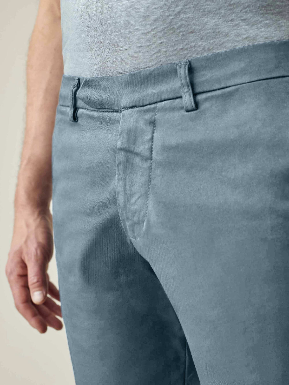 A close-up of a man wearing Luca Faloni's Light Blue Cotton Shorts, showcasing the waistband and concealed button fly.