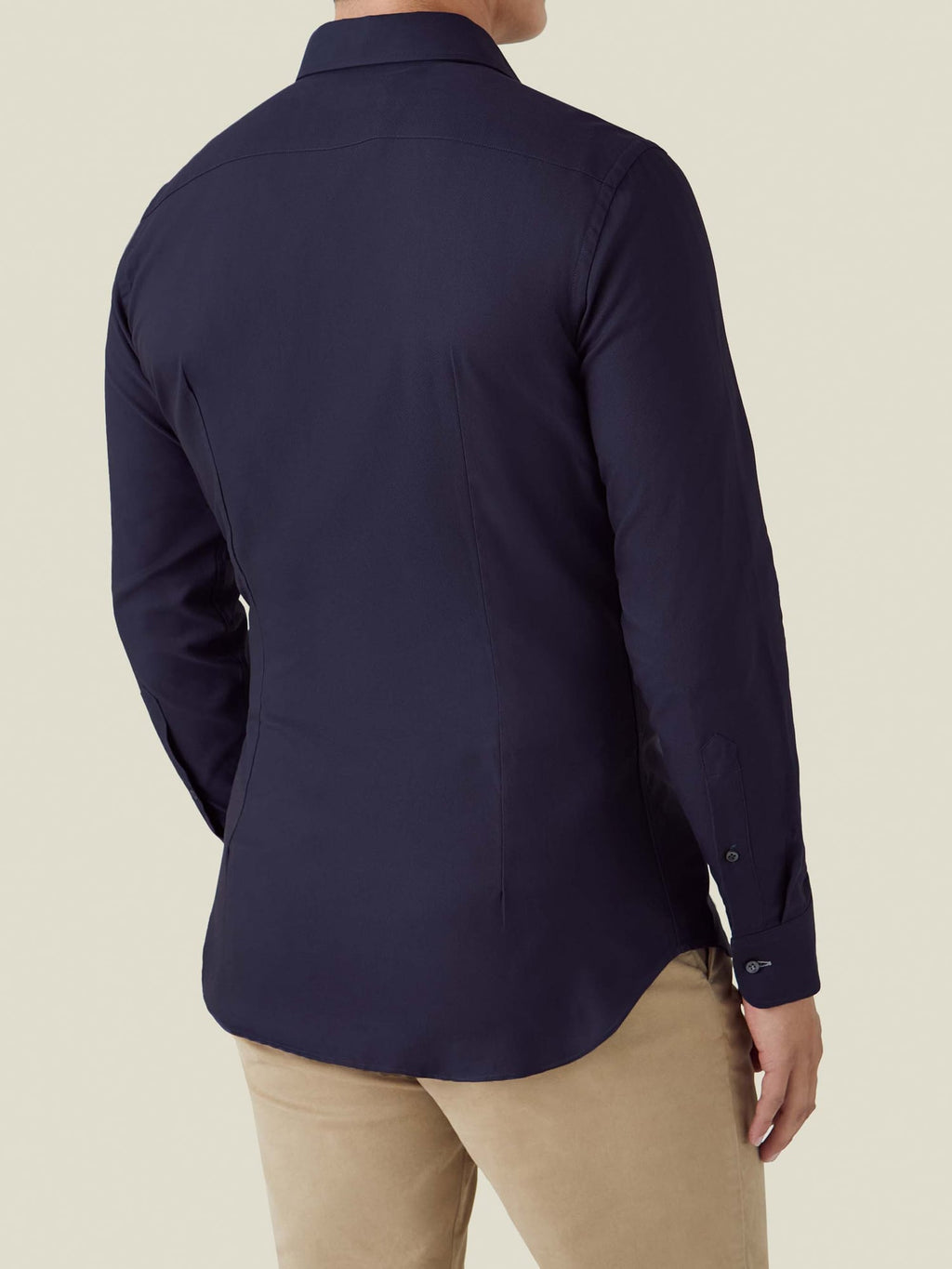 Back view of a model wearing the Oxford Cotton Shirt in midnight blue, showing the slim fit.