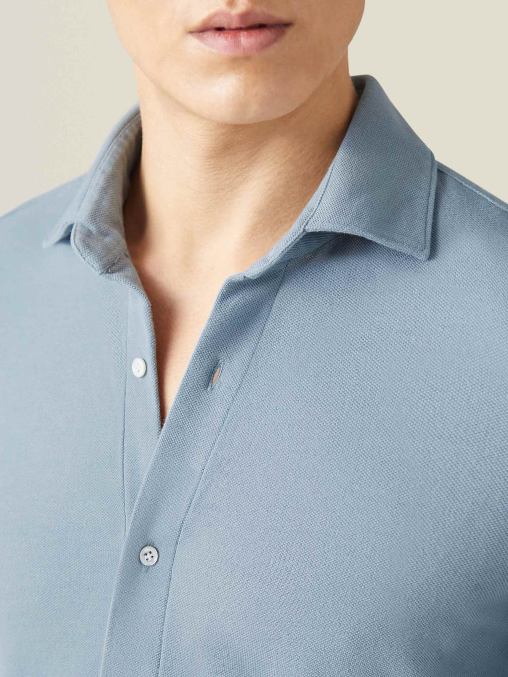 A detailed close-up of the Siena Piqué Shirt in French Blue, focusing on the cutaway collar and textured fabric.