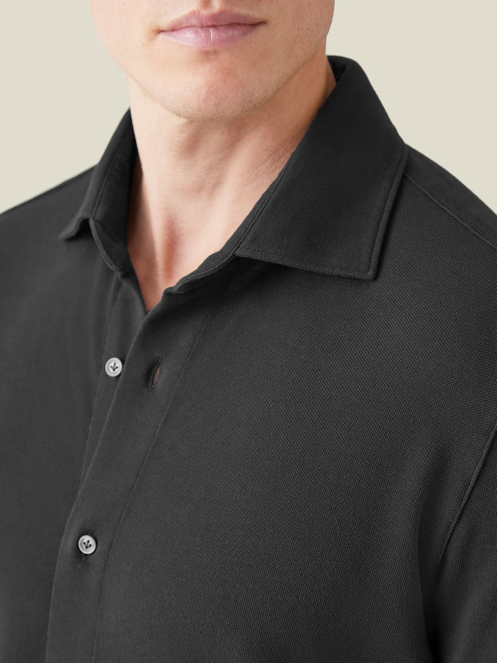 Close-up of the Siena Piqué Shirt in charcoal grey, highlighting the cutaway collar and distinctive textured fabric.