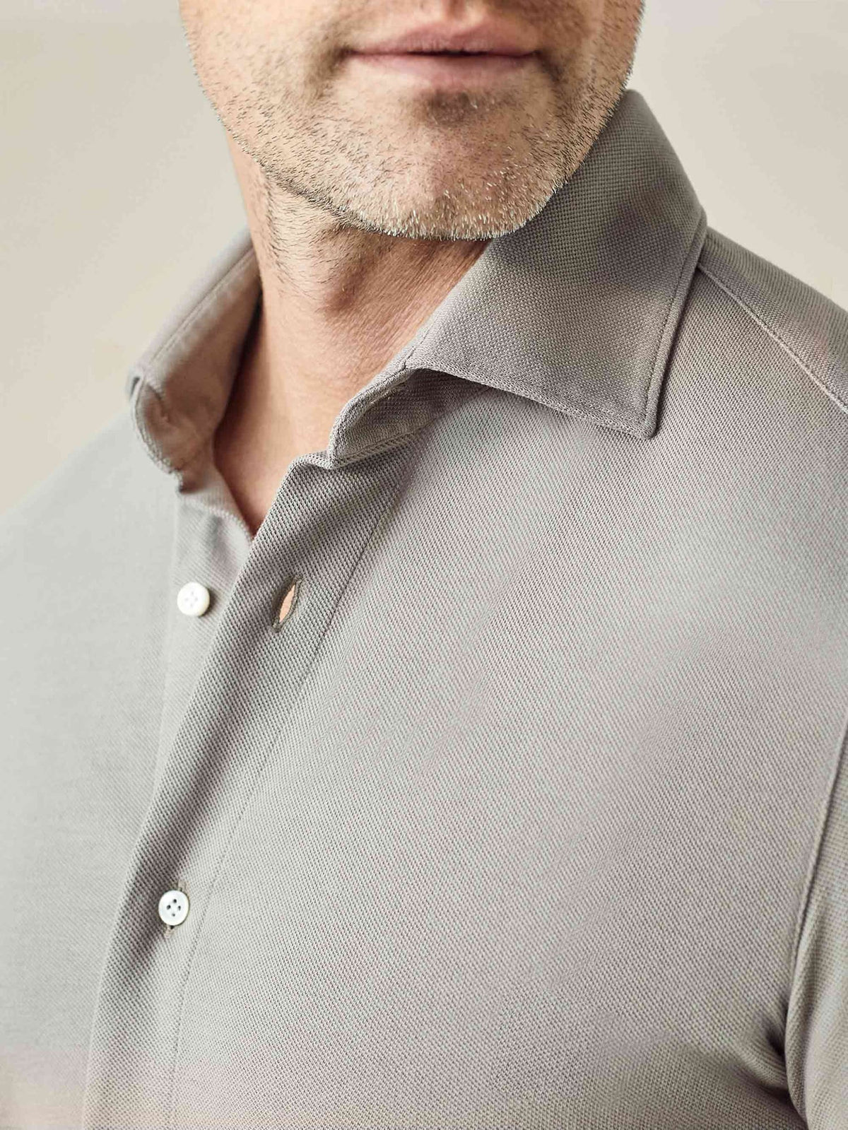 Detail of the Siena Piqué Shirt in Dove Grey, highlighting the cutaway collar and premium cotton piqué fabric texture.