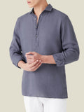 A model wears the Ravello Linen Shirt in Payne's Grey, a long-sleeve popover design with a classic cutaway collar.