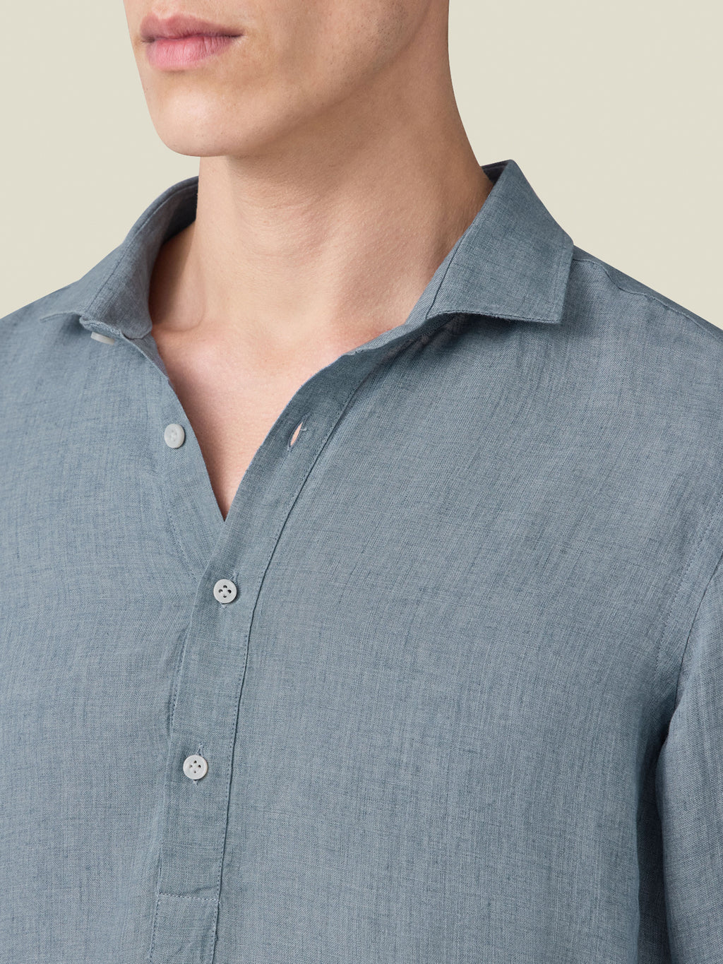 Close-up of the French Blue Ravello Linen Shirt, highlighting its cutaway collar and the texture of the Italian linen.