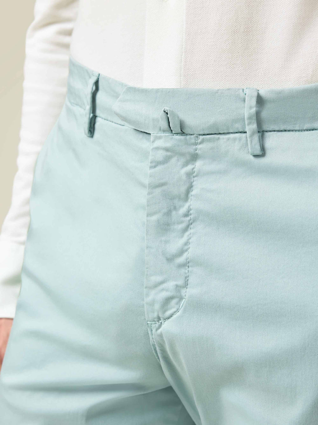 Close-up of the waistband and fly detail of the Turquoise Lightweight Cotton Chinos.