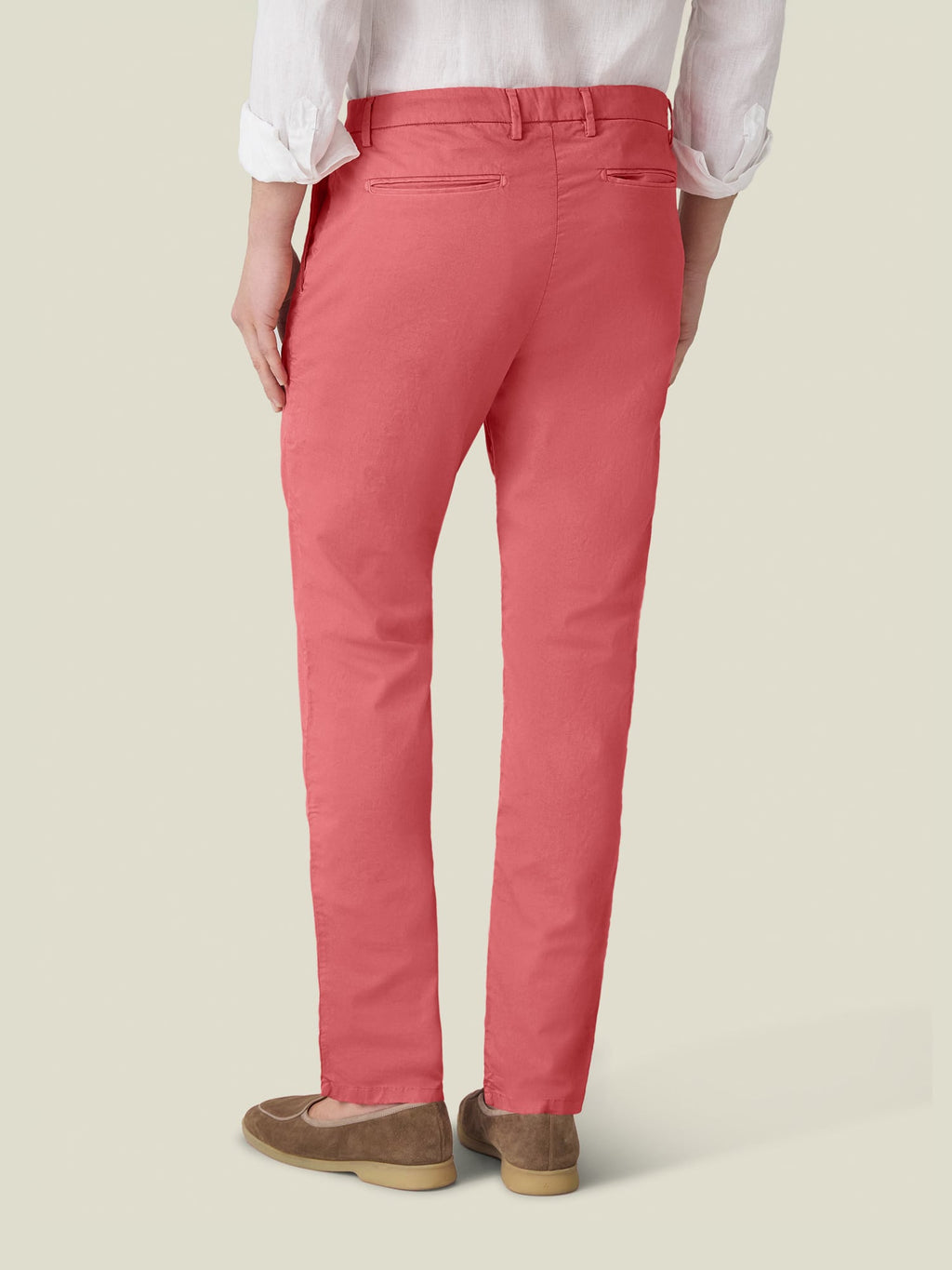 Back view of a model wearing the Strawberry Lightweight Cotton Chinos.