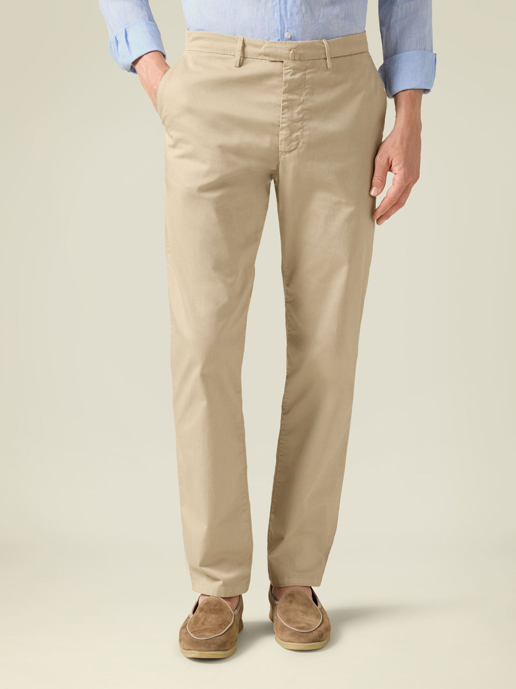 Front view of a model wearing cream Lightweight Cotton Chinos, paired with a light blue shirt and brown suede loafers.