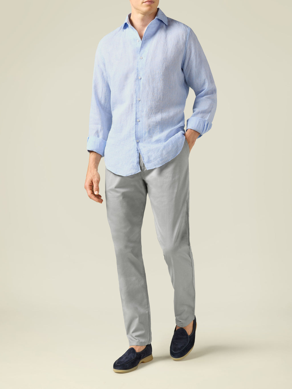 Model wearing Light Grey Lightweight Cotton Chinos with a light blue shirt and navy loafers.