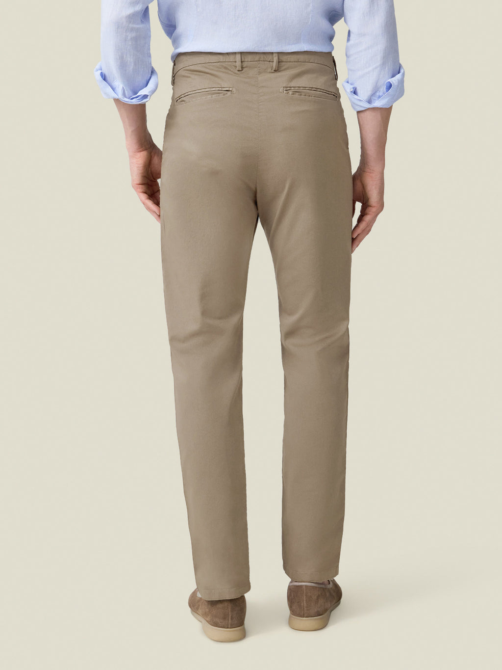 Back view of the Hazelnut Brown Lightweight Cotton Chinos on a model, highlighting the tapered fit and back pockets.