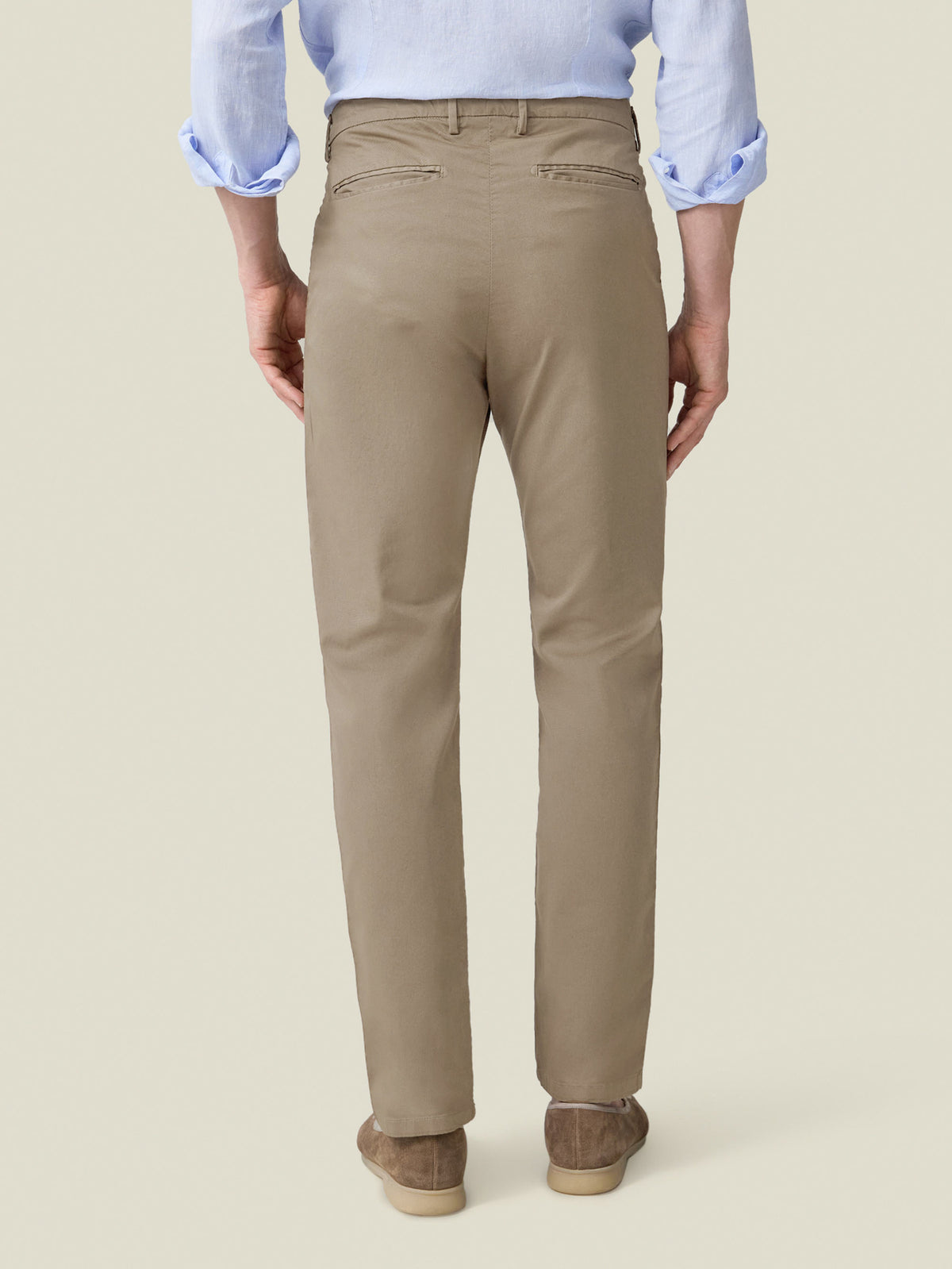 Back view of the Hazelnut Brown Lightweight Cotton Chinos on a model, highlighting the tapered fit and back pockets.