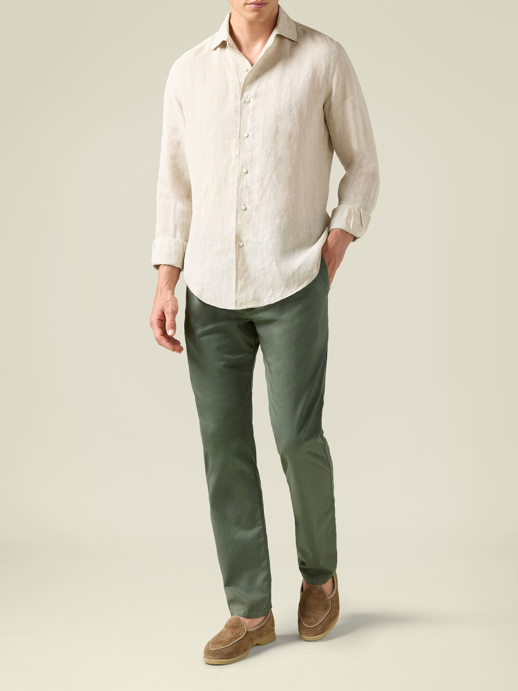 Front view of model wearing Luca Faloni's Olive Green Lightweight Cotton Chinos with a cream linen shirt and brown loafers.