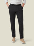 Front view of a model wearing Luca Faloni's black Lightweight Cotton Chinos with a light shirt and beige sneakers.