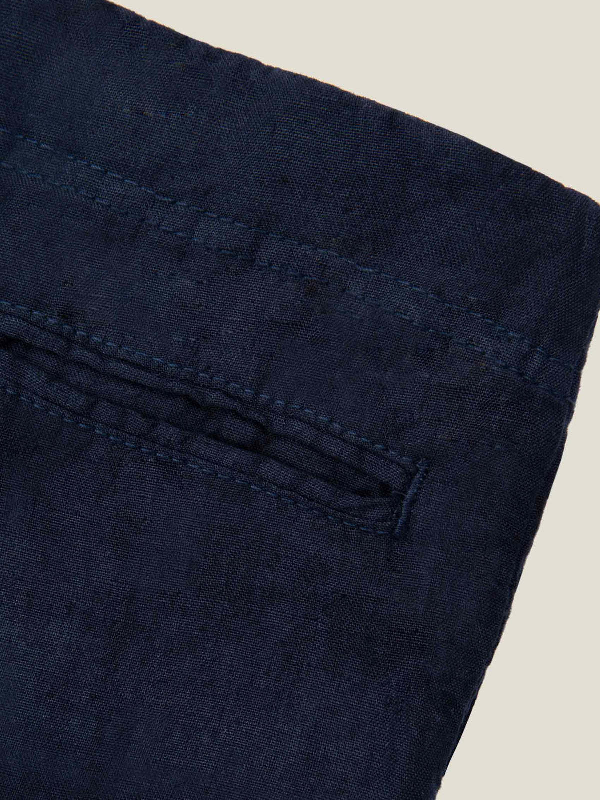 Close-up detail of the back pocket on the Navy Blue Lipari Junior Linen Trousers, highlighting the fine linen texture.