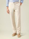 Front view of a model wearing the Luca Faloni Lipari Linen Trousers in sand against a plain background.