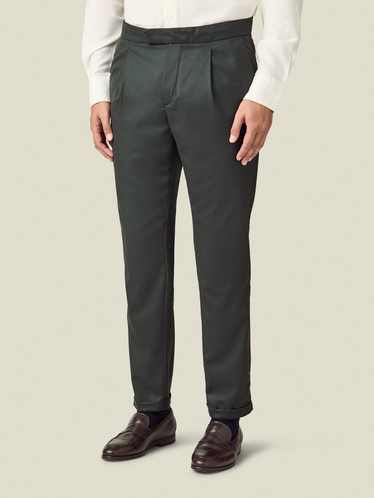 Front view of the Luca Faloni Wool Pleated Trousers in khaki green, worn by a model.