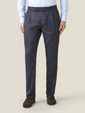 Front view of a model wearing Luca Faloni's Charcoal Grey Wool Pleated Trousers.
