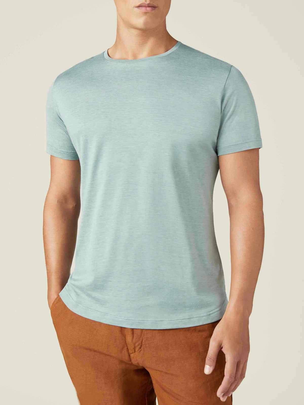 Front view of a model wearing the Luca Faloni Silk-Cotton T-Shirt in Marine Green.