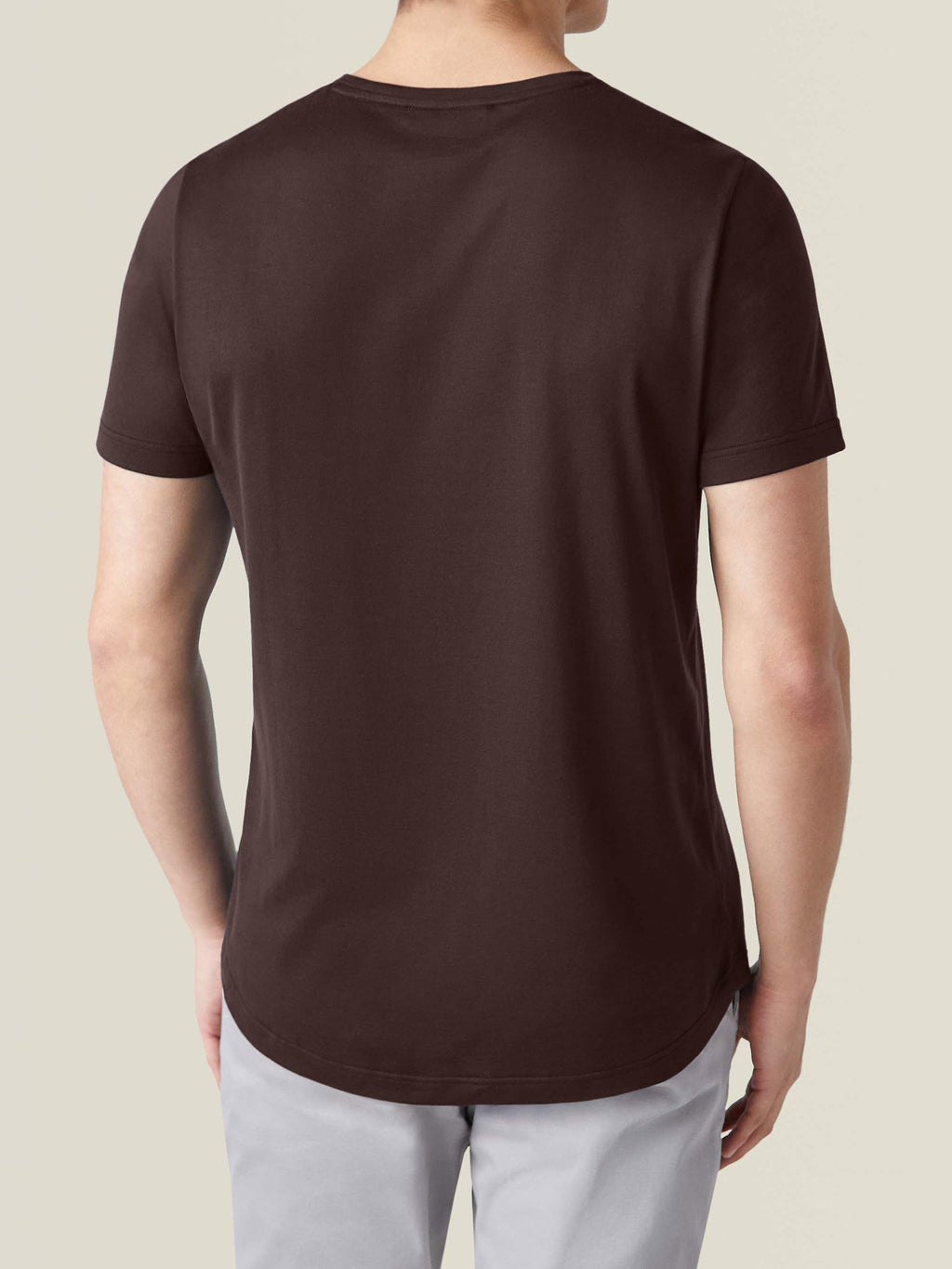 Back view of a model wearing the Luca Faloni Chocolate Brown Silk-Cotton T-Shirt, showing the fit and rounded hemline.