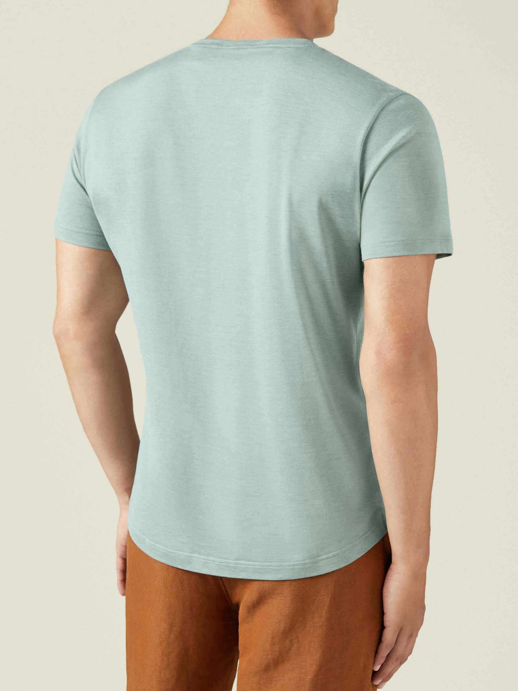 Back view of a model wearing the Luca Faloni Silk-Cotton T-Shirt in Marine Green.