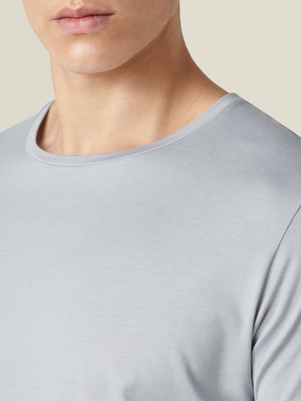 Detail shot of the crew neckline on the Luca Faloni light grey Silk-Cotton T-Shirt, showcasing the fine fabric.