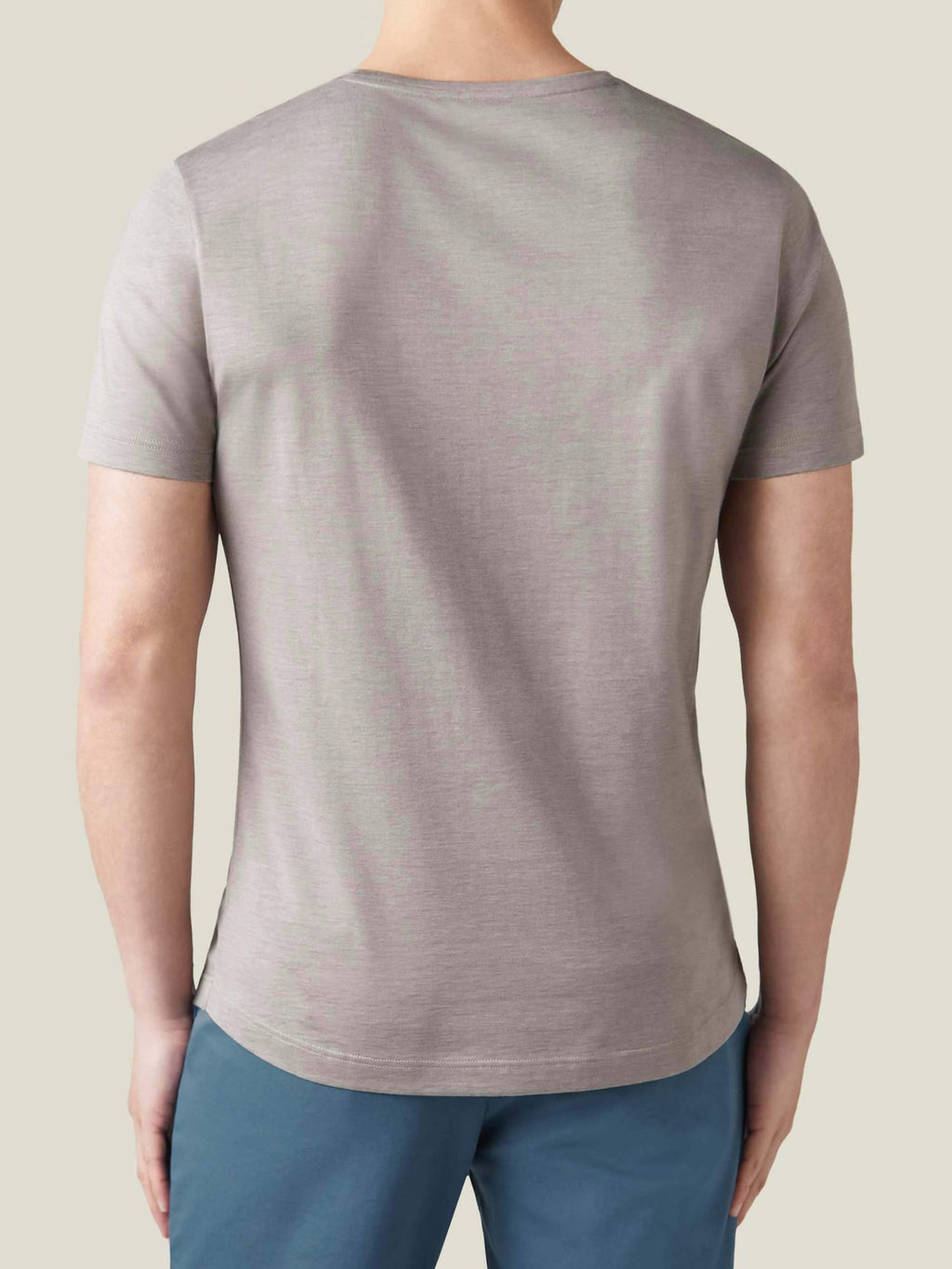 Back view of a model wearing the Silk-Cotton T-Shirt in Nocciola Brown.
