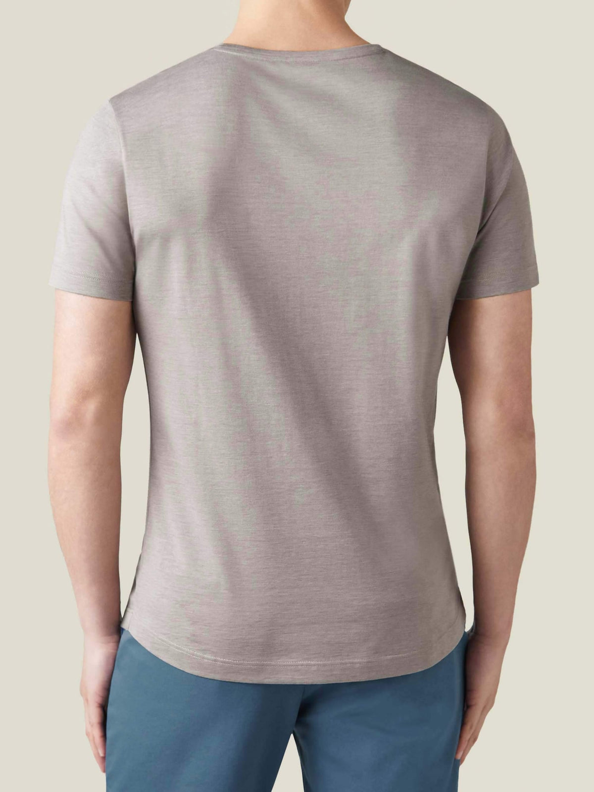 Back view of a model wearing the Silk-Cotton T-Shirt in Nocciola Brown.