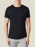 Front view of a model wearing the Luca Faloni black silk-cotton T-shirt, showcasing its classic fit and crew neckline.