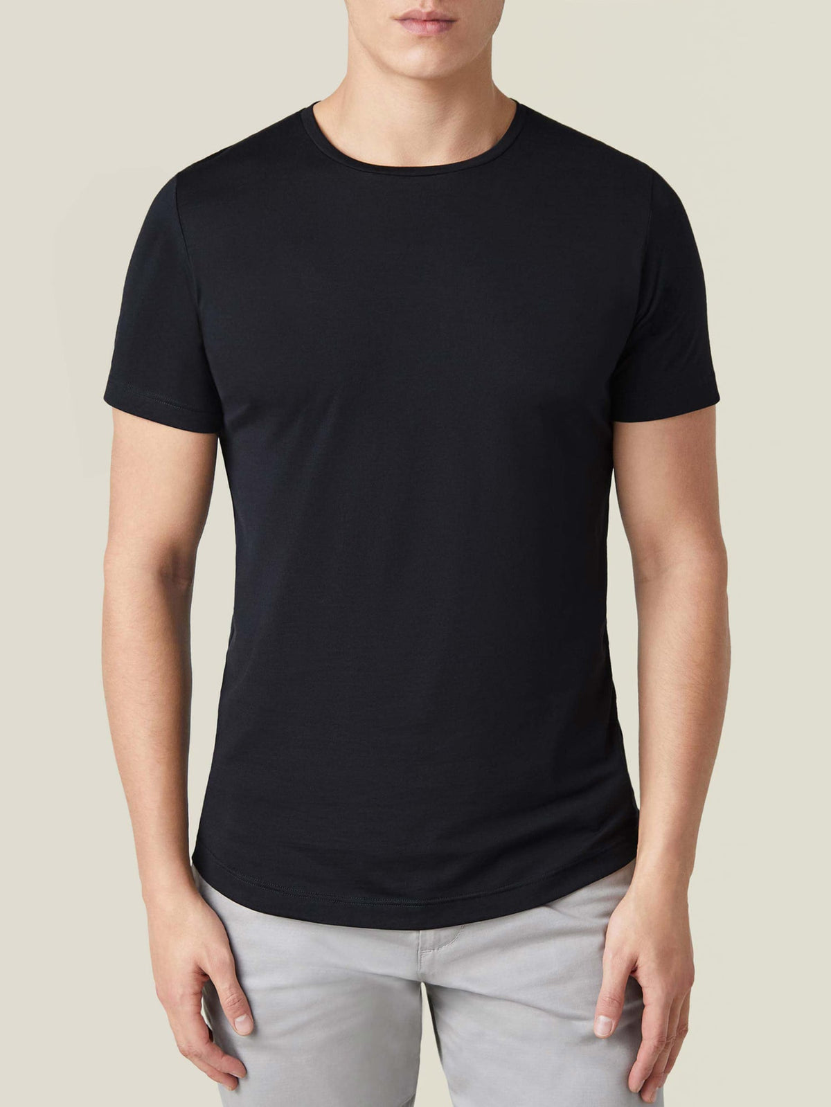 Front view of a model wearing the Luca Faloni black silk-cotton T-shirt, showcasing its classic fit and crew neckline.