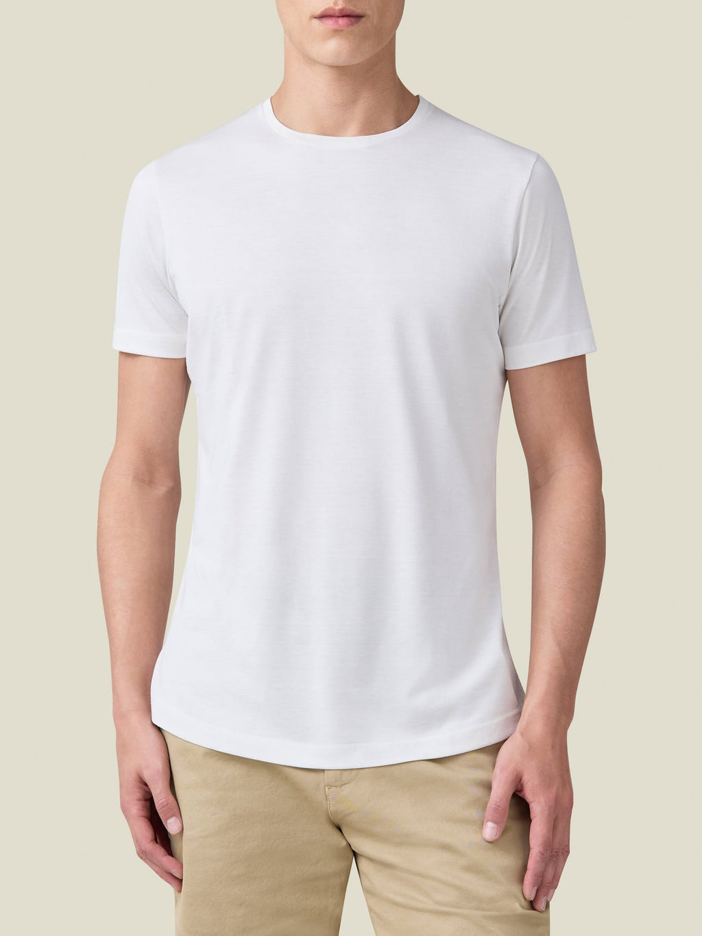 Front view of a model wearing the Luca Faloni white silk-cotton t-shirt, highlighting its refined fit and crew neckline.