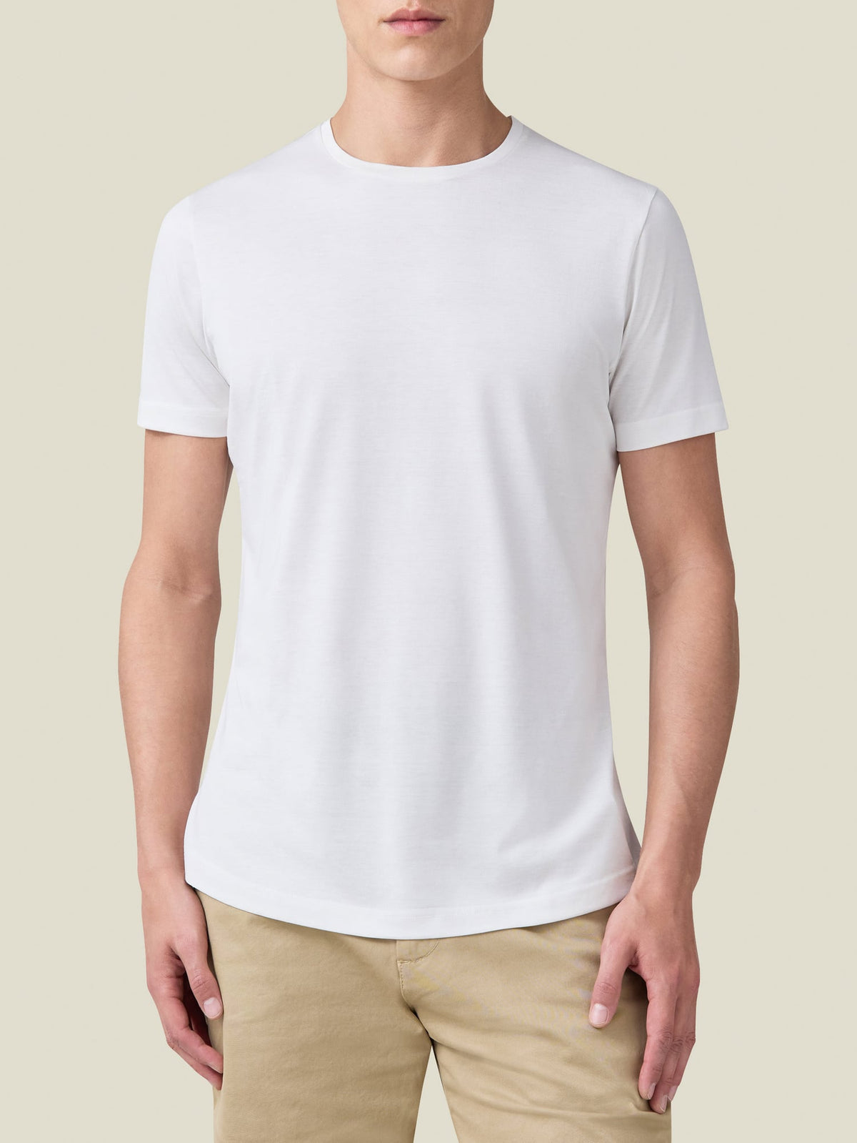 Front view of a model wearing the Luca Faloni white silk-cotton t-shirt, highlighting its refined fit and crew neckline.