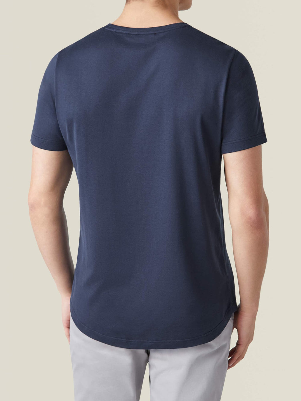Back view of a man wearing the Luca Faloni Midnight Blue Silk-Cotton T-Shirt, highlighting the classic fit and curved hem.