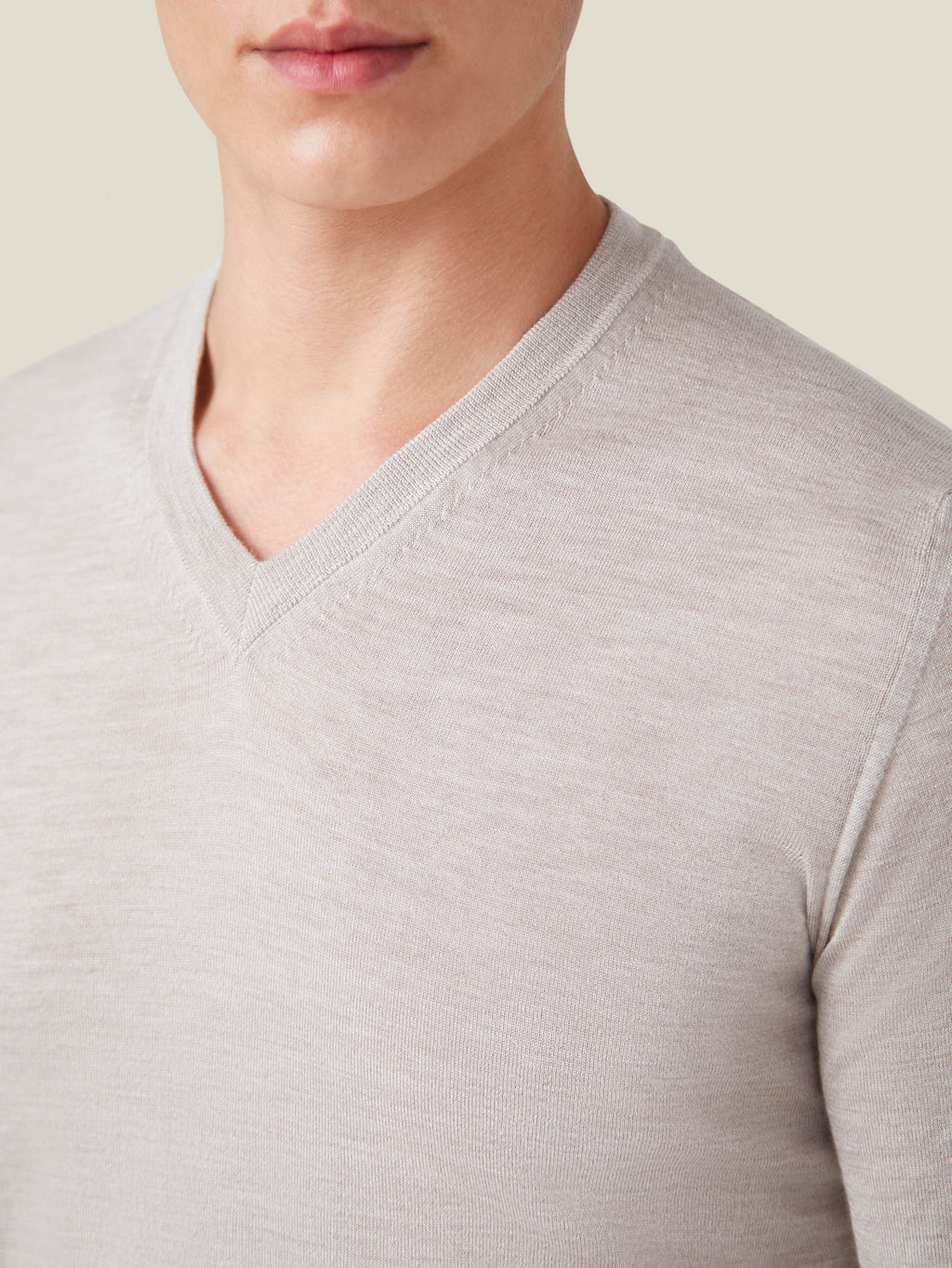 Close-up of the Oatmeal Silk-Cashmere V-Neck, detailing the ribbed neckline and fine knit.