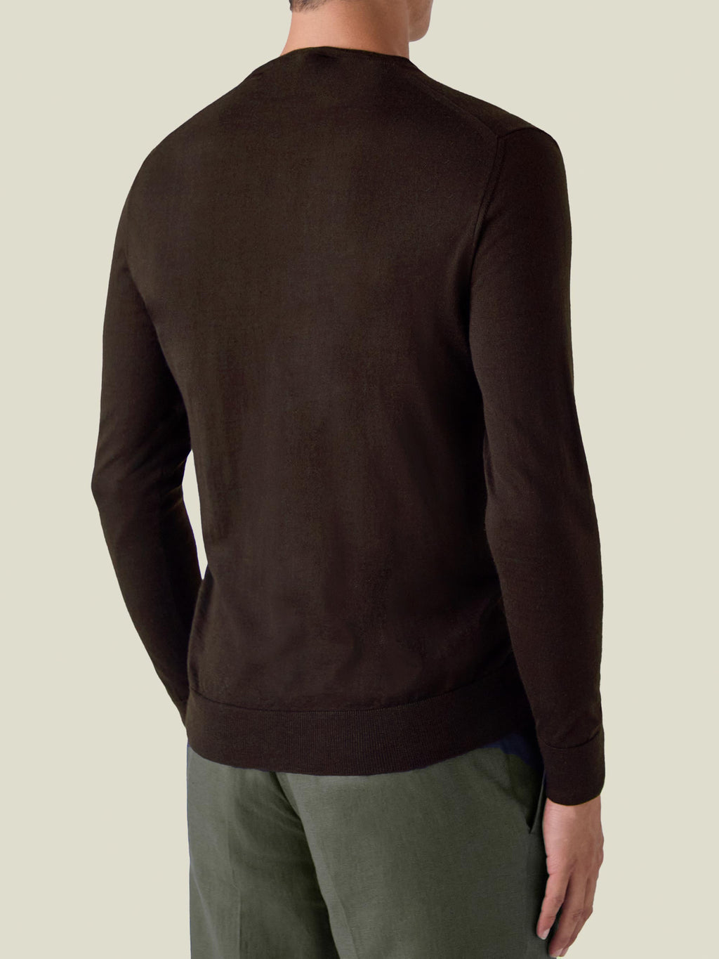 Back view of a model wearing the Chocolate Brown Silk-Cashmere V-Neck.