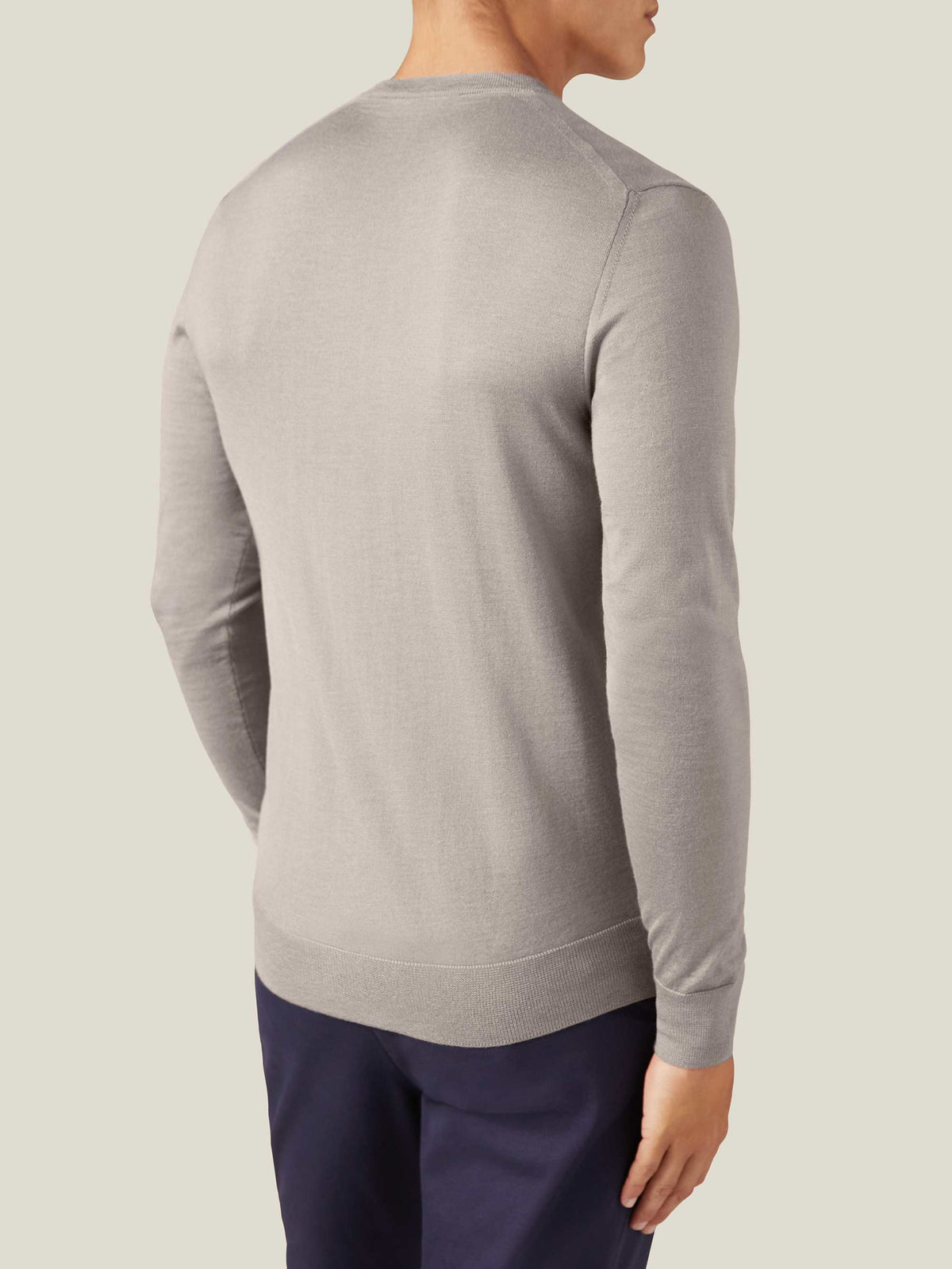 Back view of a model wearing the Nocciola Brown Silk-Cashmere V-Neck.