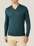 Front view of a model wearing the Forest Green Silk-Cashmere V-Neck jumper with a pair of beige trousers.