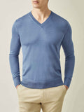 Front view of a model wearing the Luca Faloni Silk-Cashmere V-Neck in Azure Blue, paired with beige chinos.