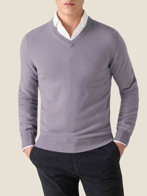 Model wears the Luca Faloni Pure Cashmere V Neck in Violet, layered over a white collared shirt and dark trousers.