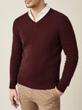 Man wearing the Luca Faloni Lava Red Cashmere V Neck sweater with a white collared shirt and beige chinos.