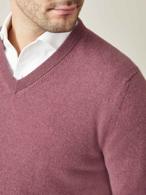 Close-up on the neckline of the Luca Faloni Desert Rose Cashmere V Neck, styled over a classic white collared shirt.